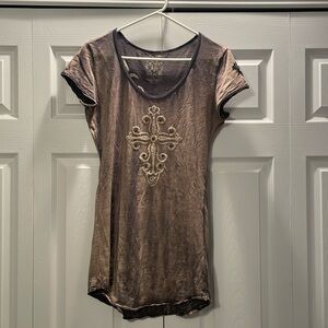 Women’s distressed t-shirt. Embellishments on the front and back.